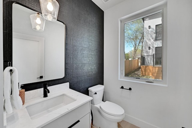 4703 Mount Vernon Dr Unit 2, Austin, TX 78745 - half bathroom with toilet, vanity, and baseboards
