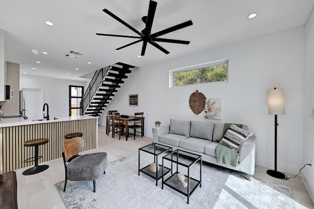 4703 Mount Vernon Dr Unit 2, Austin, TX 78745 - living area featuring light wood-type flooring, stairway, recessed lighting, and a ceiling fan