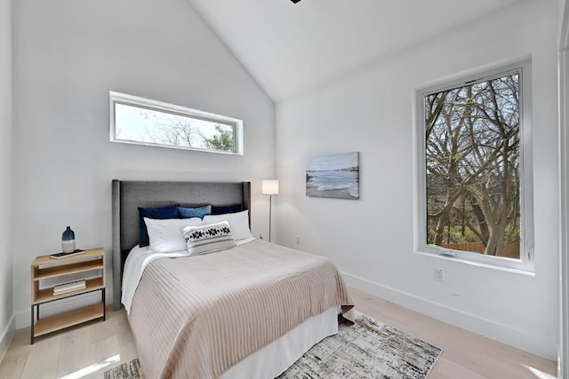4703 Mount Vernon Dr Unit 2, Austin, TX 78745 - bedroom with light wood finished floors, lofted ceiling, and baseboards