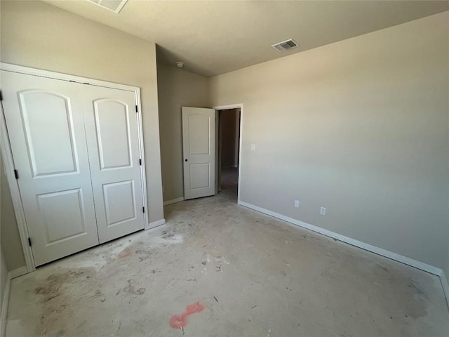 2456 Walking Y Rd, Georgetown, TX 78633 - unfurnished bedroom featuring unfinished concrete floors, baseboards, and a closet