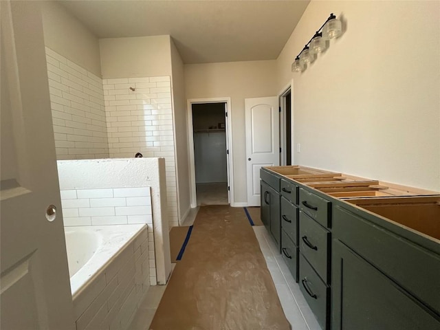 2456 Walking Y Rd, Georgetown, TX 78633 - bathroom featuring a bath, a spacious closet, and vanity