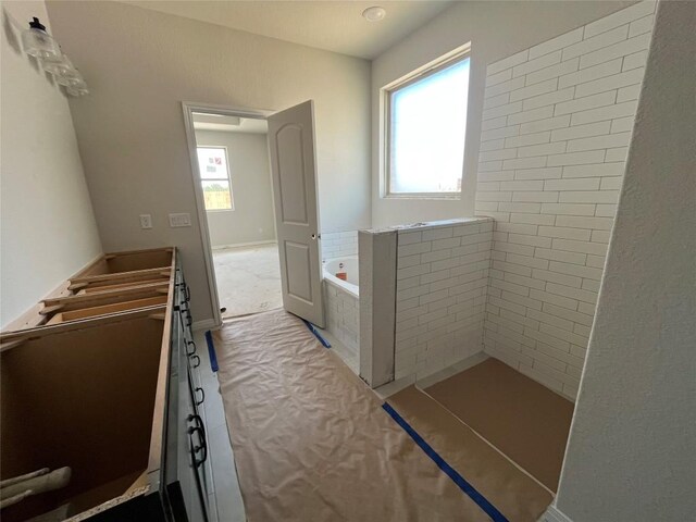 2456 Walking Y Rd, Georgetown, TX 78633 - full bathroom featuring a garden tub, baseboards, and vanity