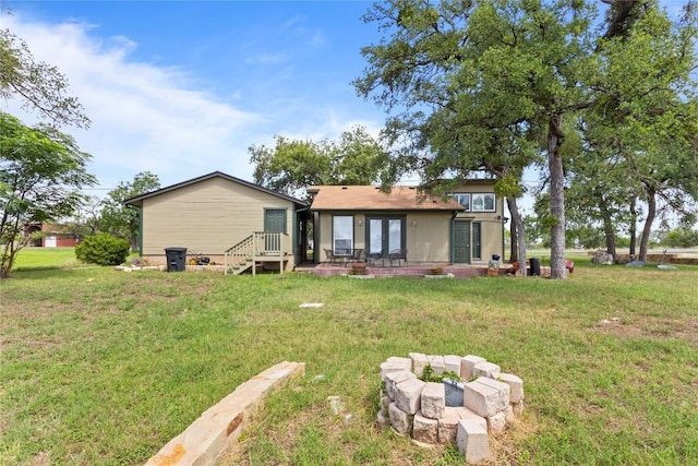 25421 Pedernales Point Dr, Spicewood, TX 78669 - rear view of house with french doors and a yard