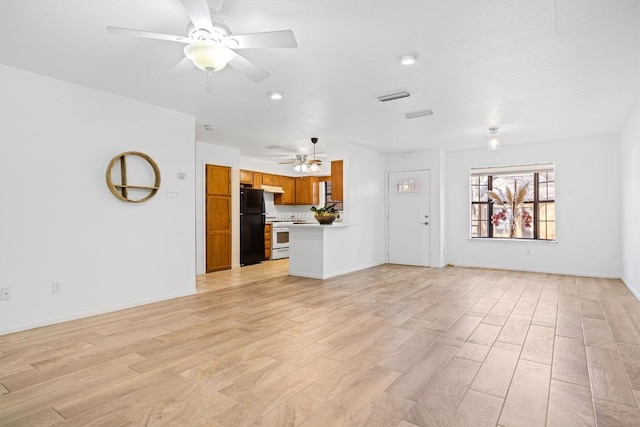2301 Lawnmont Ave Apt 1, Austin, TX 78756 - unfurnished living room featuring ceiling fan and light wood-style flooring