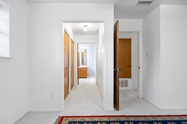 2301 Lawnmont Ave Apt 1, Austin, TX 78756 - hallway featuring carpet and attic access