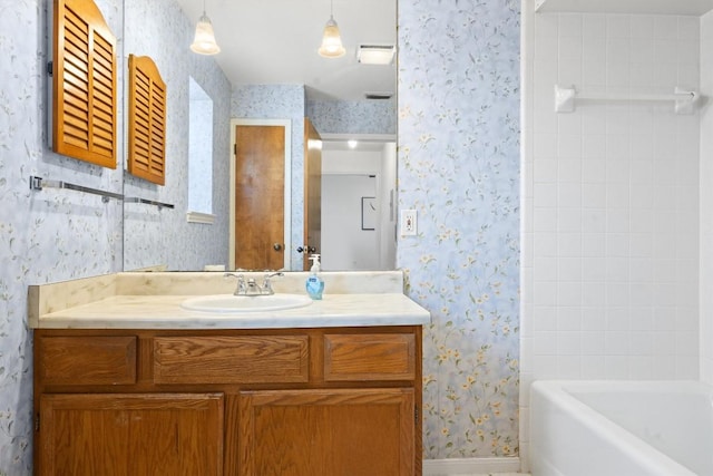 2301 Lawnmont Ave Apt 1, Austin, TX 78756 - bathroom featuring wallpapered walls, vanity, and shower / bathtub combination with curtain