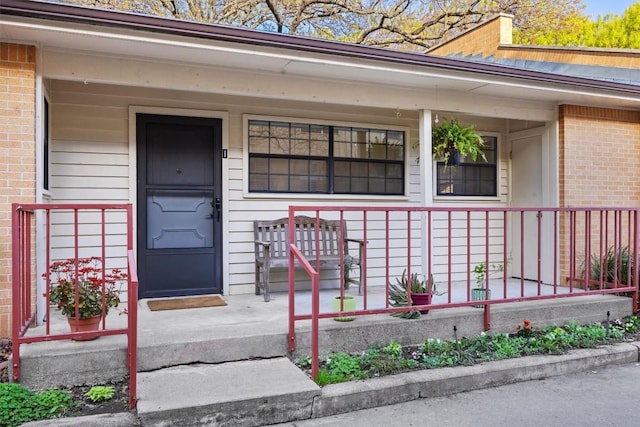 2301 Lawnmont Ave Apt 1, Austin, TX 78756 - view of exterior entry featuring brick siding and covered porch