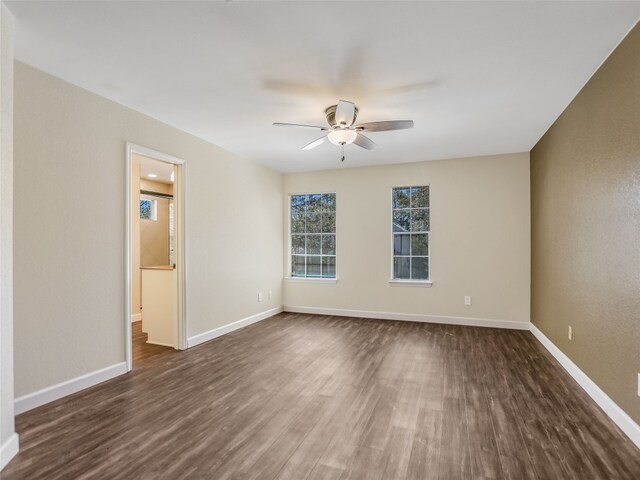 716 Shiny Rock Dr, Austin, TX 78748 - spare room featuring dark wood-type flooring, a ceiling fan, and baseboards