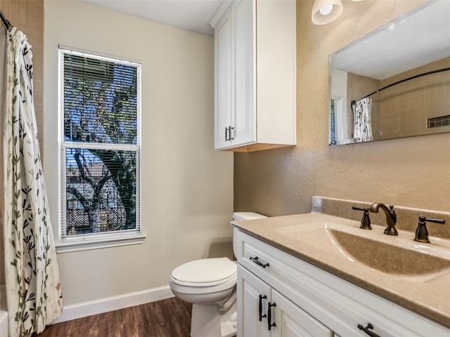 716 Shiny Rock Dr, Austin, TX 78748 - bathroom featuring toilet, vanity, curtained shower, wood finished floors, and baseboards