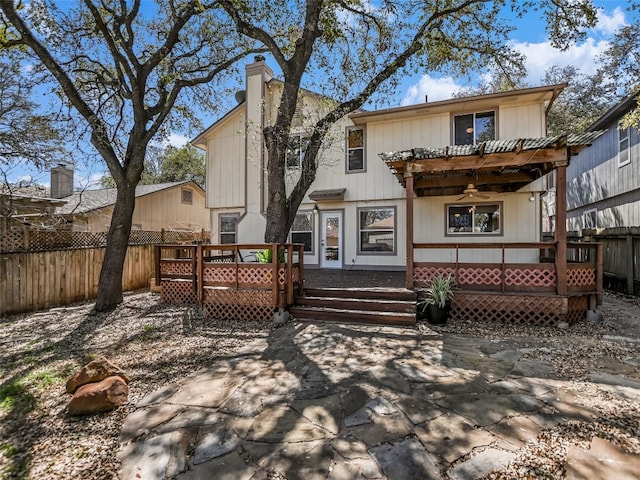 716 Shiny Rock Dr, Austin, TX 78748 - back of property with a ceiling fan, a chimney, and a wooden deck