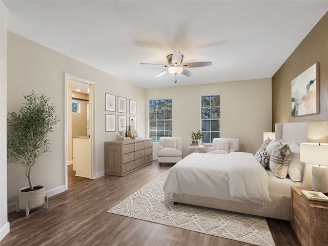 716 Shiny Rock Dr, Austin, TX 78748 - bedroom with wood finished floors, ensuite bath, baseboards, and a ceiling fan