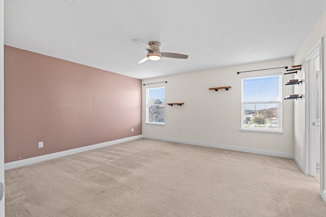 12923 Dwight Eisenhower St, Manor, TX 78653 - spare room featuring a ceiling fan, light carpet, and baseboards