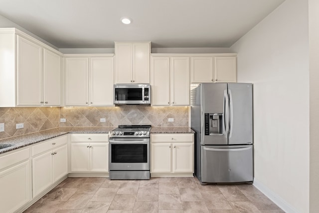 12923 Dwight Eisenhower St, Manor, TX 78653 - kitchen with stainless steel appliances, light stone counters, backsplash, and recessed lighting