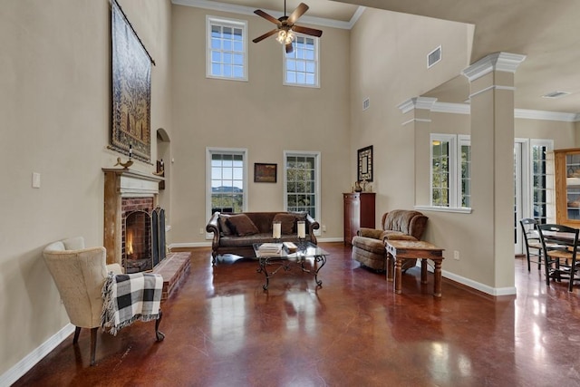 living area featuring baseboards, ceiling fan, and visible vents