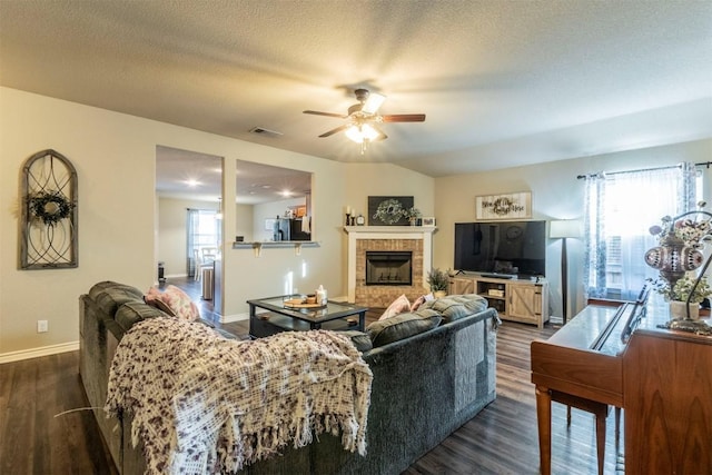 6806 Ambrose Cir, Temple, TX 76502 - living room with dark wood finished floors, visible vents, plenty of natural light, and ceiling fan
