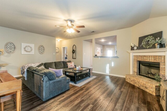 6806 Ambrose Cir, Temple, TX 76502 - living room featuring visible vents, baseboards, a fireplace, wood finished floors, and a ceiling fan