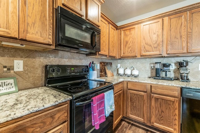 6806 Ambrose Cir, Temple, TX 76502 - kitchen with brown cabinets, backsplash, and black appliances