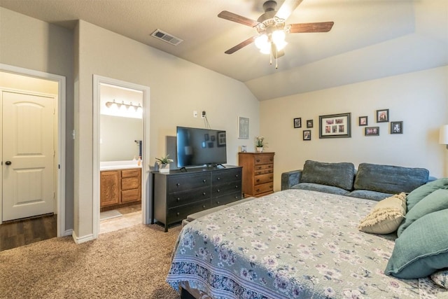 6806 Ambrose Cir, Temple, TX 76502 - bedroom with visible vents, connected bathroom, ceiling fan, carpet floors, and vaulted ceiling