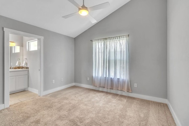 402 Irma Dr Unit B, Austin, TX 78752 - empty room featuring light carpet, ceiling fan, and vaulted ceiling