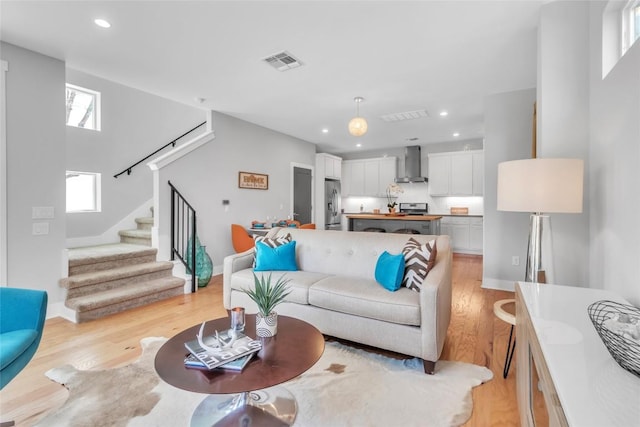 402 Irma Dr Unit B, Austin, TX 78752 - living area with light wood-type flooring, stairs, and recessed lighting