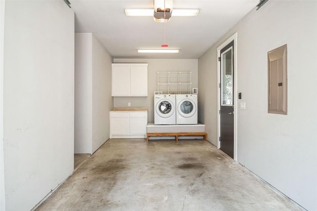 402 Irma Dr Unit B, Austin, TX 78752 - laundry area featuring separate washer and dryer, electric panel, and cabinet space