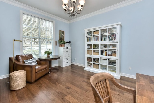 living area featuring baseboards, wood finished floors, a notable chandelier, and crown molding