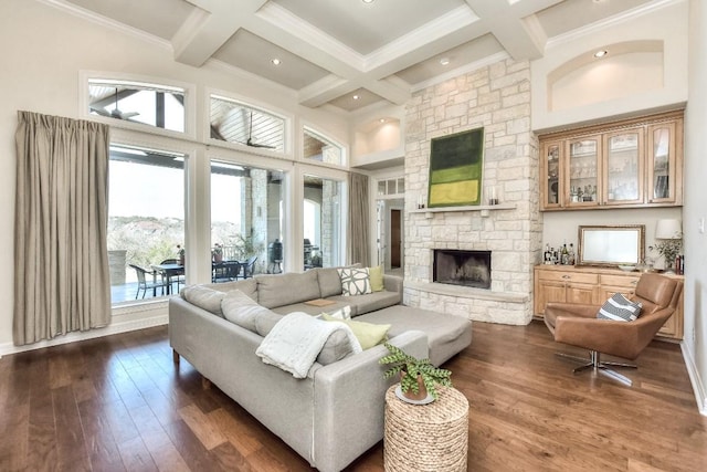 living area with dark wood-style floors, coffered ceiling, beamed ceiling, baseboards, and a fireplace