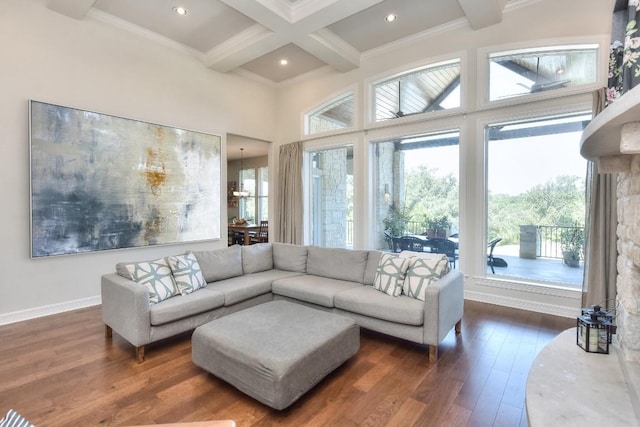 living room featuring crown molding, dark wood-type flooring, coffered ceiling, beam ceiling, and recessed lighting
