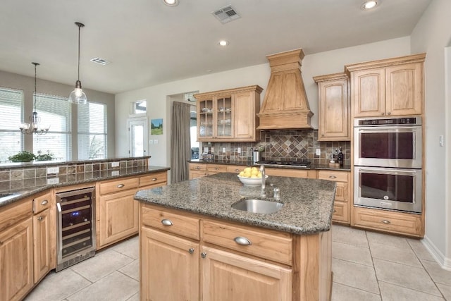 kitchen with beverage cooler, stainless steel appliances, a sink, tasteful backsplash, and custom exhaust hood