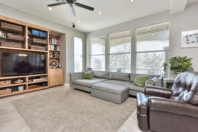 living area with a ceiling fan, recessed lighting, and light tile patterned floors