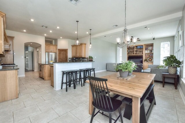 dining room with baseboards, visible vents, recessed lighting, and a notable chandelier