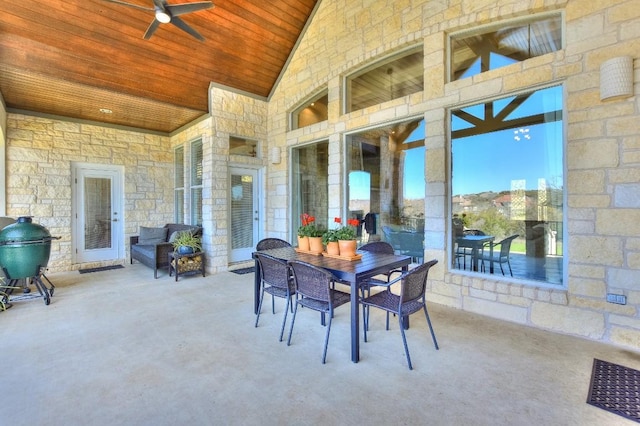 view of patio / terrace featuring outdoor dining area and ceiling fan