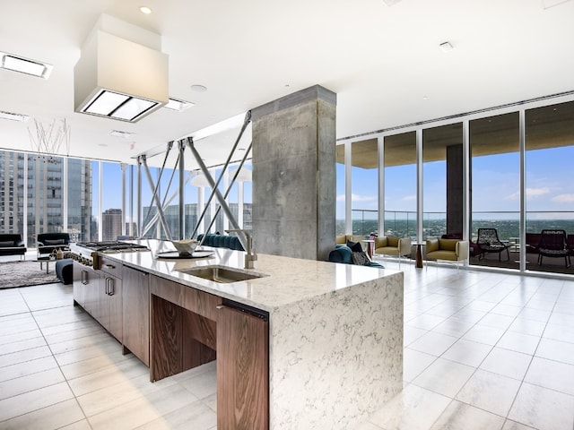 301 W Ave Unit 1301, Austin, TX 78701 - kitchen featuring floor to ceiling windows, a sink, modern cabinets, open floor plan, and a spacious island