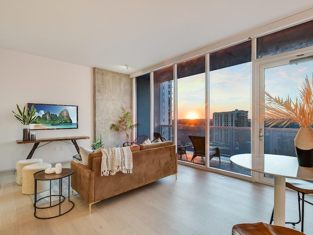 301 W Ave Unit 1301, Austin, TX 78701 - living room with expansive windows, plenty of natural light, and wood finished floors