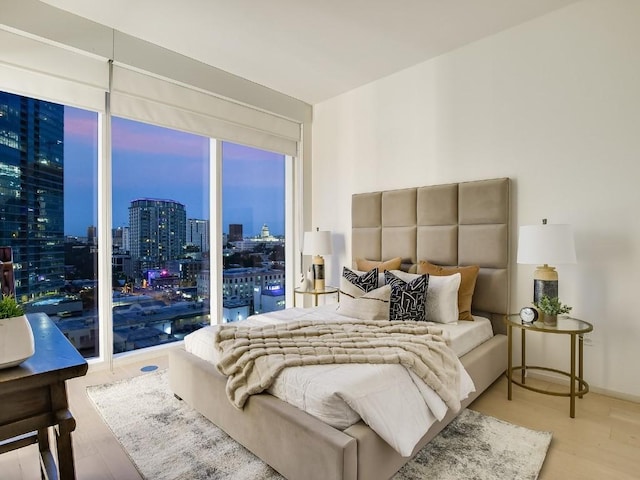 301 W Ave Unit 1301, Austin, TX 78701 - bedroom featuring wood finished floors and a view of city