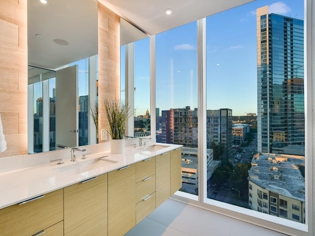 301 W Ave Unit 1301, Austin, TX 78701 - bathroom featuring double vanity, a view of city, a wall of windows, and tile patterned flooring