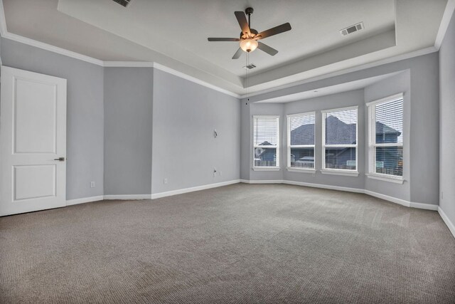 252 Sabino Dr, Buda, TX 78610 - unfurnished room featuring a raised ceiling, ceiling fan, carpet floors, baseboards, and ornamental molding