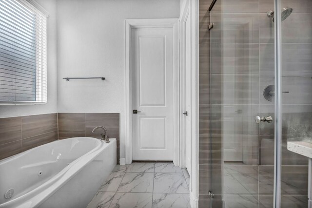 252 Sabino Dr, Buda, TX 78610 - full bathroom with marble finish flooring, plenty of natural light, a jetted tub, and a stall shower