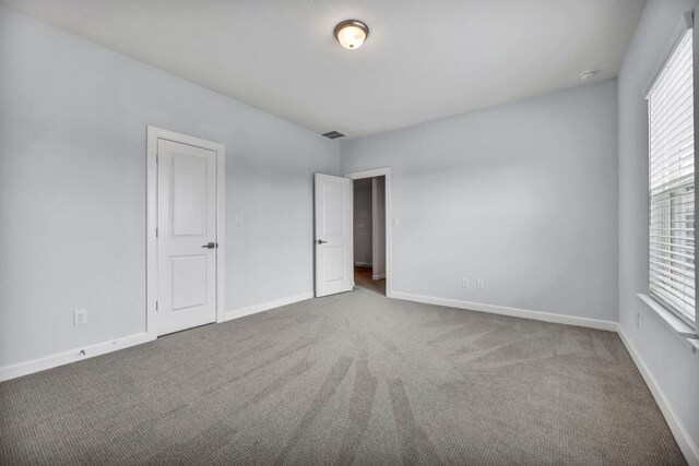 252 Sabino Dr, Buda, TX 78610 - unfurnished bedroom featuring carpet floors and baseboards