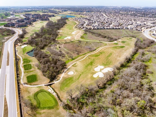 aerial view featuring a water view and view of golf course