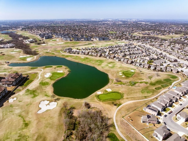 birds eye view of property featuring a residential view, a water view, and view of golf course