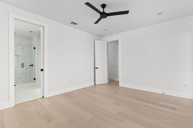 802 Philco Dr Unit 1, Austin, TX 78745 - unfurnished bedroom with light wood-style flooring and ensuite bathroom