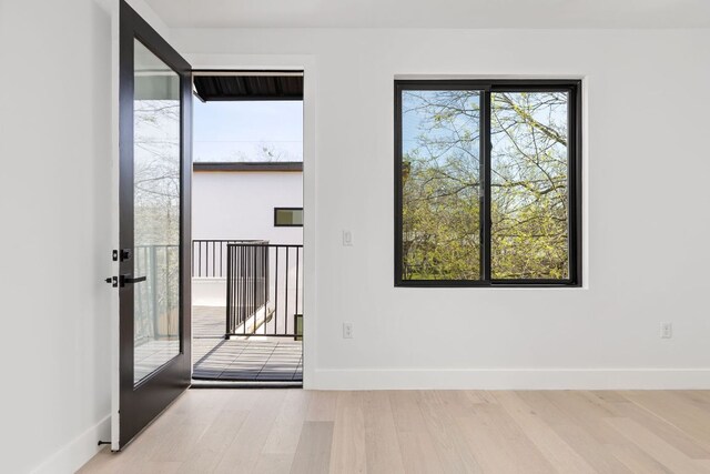 802 Philco Dr Unit 1, Austin, TX 78745 - empty room featuring wood finished floors and baseboards