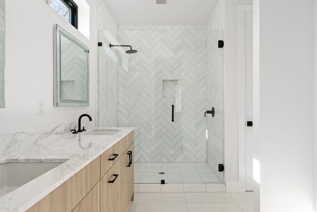 802 Philco Dr Unit 1, Austin, TX 78745 - bathroom featuring double vanity and a shower stall