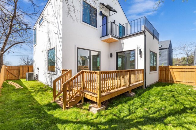 802 Philco Dr Unit 1, Austin, TX 78745 - back of house with a balcony, stucco siding, a fenced backyard, and a gate
