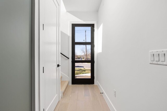 802 Philco Dr Unit 1, Austin, TX 78745 - doorway with light wood-style floors and baseboards