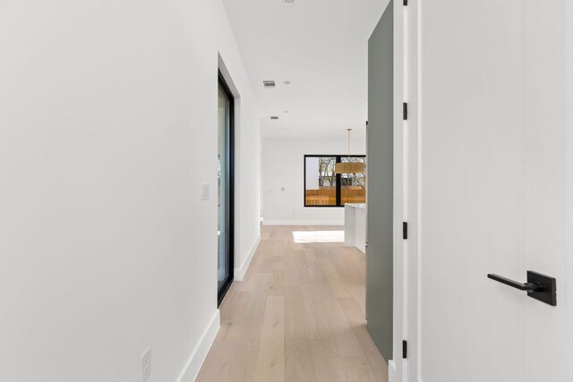802 Philco Dr Unit 1, Austin, TX 78745 - corridor with light wood-type flooring and baseboards