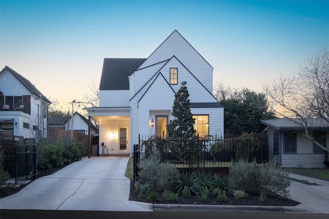 4408 Jinx Ave Unit 1, Austin, TX 78745 - view of front facade featuring driveway, roof with shingles, and a carport