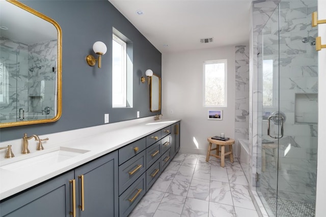 4408 Jinx Ave Unit 1, Austin, TX 78745 - bathroom featuring marble look tiles, double vanity, and a marble finish shower