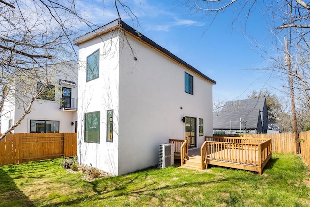 802 Philco Dr Unit 2, Austin, TX 78745 - back of property with stucco siding and a deck